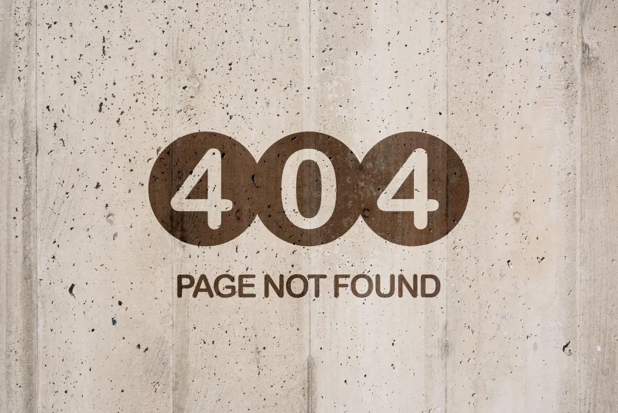 404 page not found error displayed on a concrete wall, a common issue identified during a technical SEO site audit