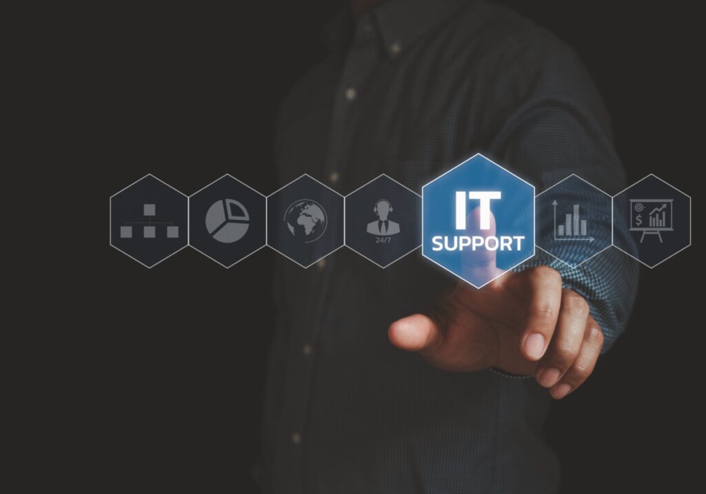 Businessman interacting with virtual interface for technical assistance, representing Managed IT Support services for businesses