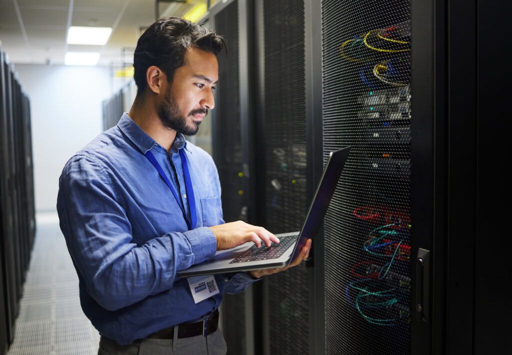 IT technician managing server racks, featured in an IT services case study